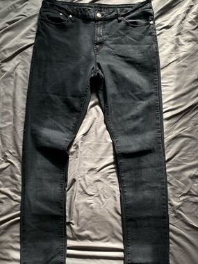 Faded black stacked skinny jeans with a stretchy fit